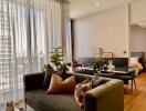 Modern living room with a view of a bedroom through an open door