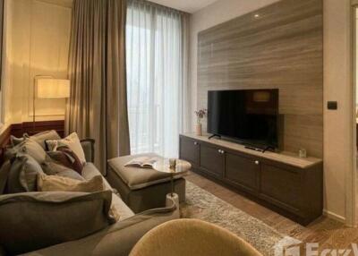 Modern living room with a comfortable seating area and flat-screen TV