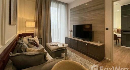 Modern living room with a comfortable seating area and flat-screen TV