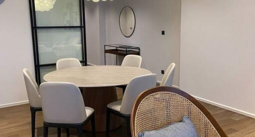 Modern dining area with round table and contemporary chairs