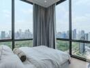 Luxury modern bedroom with floor-to-ceiling windows and city view