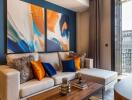 Modern living room with colorful abstract paintings and cozy seating