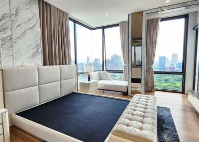 Modern bedroom with city views and large windows