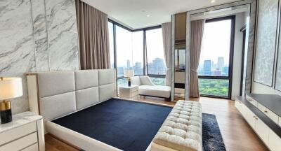 Modern bedroom with city views and large windows