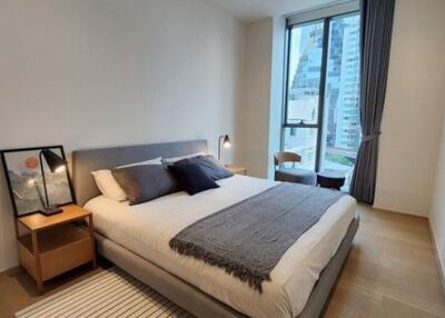 Modern bedroom with double bed and city view