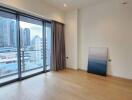 bright living room with large windows overlooking the city