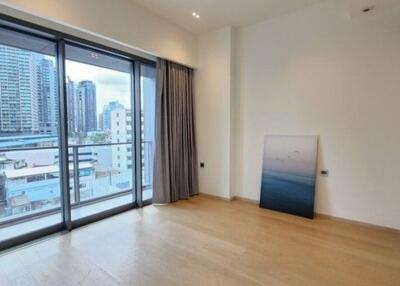 Modern living room with large windows and city view