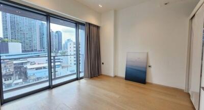 Modern living room with large windows and city view