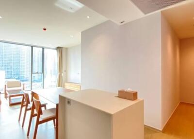 Modern living room with dining area and natural light