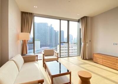 Modern living room with large windows and city views