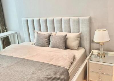 Modern bedroom with a stylish headboard and bedside table
