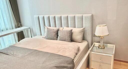 Modern bedroom with a stylish headboard and bedside table