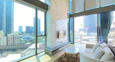 Modern high-rise living room with large windows and city view