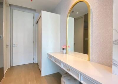 Elegant bedroom vanity with gold-framed mirror