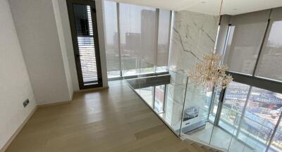 Modern living room with large windows and city view