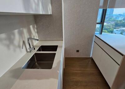 Modern kitchen with dual sinks and large window