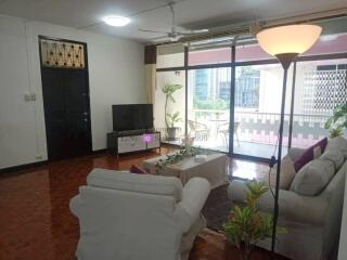 Spacious living room with large windows and modern decor