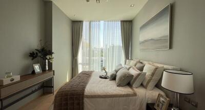 Modern bedroom with large window and elegant decor