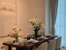 Modern dining room with a well-set dining table and floral centerpiece