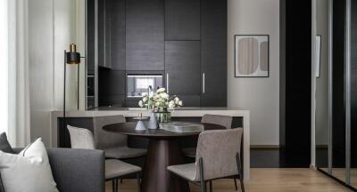 Modern dining area with a kitchen in the background