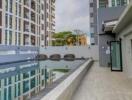 Outdoor view of residential buildings with a swimming pool