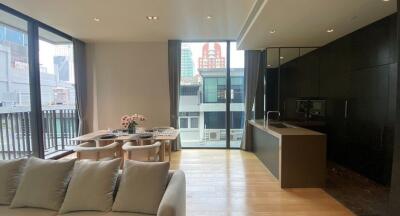 Modern open-plan living and dining area with city view