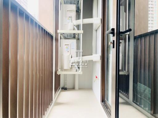 View of a balcony with air conditioning units and safety railings