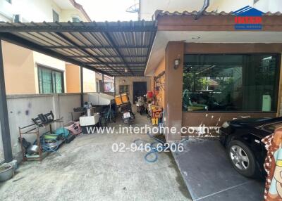 Outdoor carport area with miscellaneous items
