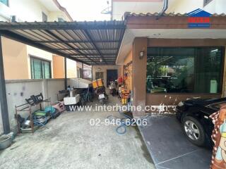 Outdoor carport area with miscellaneous items