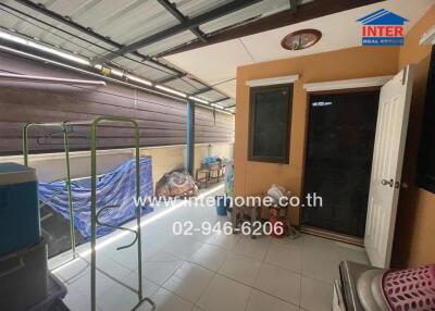 Enclosed outdoor area with laundry drying rack and storage