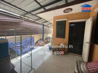 Enclosed outdoor area with laundry drying rack and storage