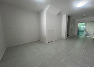 Spacious white tiled main living area