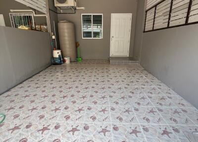 Well-maintained garage space with tiled flooring