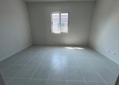 Empty room with tiled floor and window