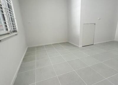 empty room with tiled floor and window