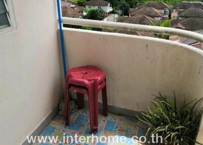 Small balcony with a view and colorful tiled floor