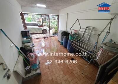 Laundry room with cleaning supplies and equipment in a property