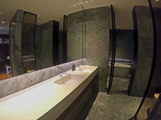 Modern bathroom with double sink and freestanding bathtub