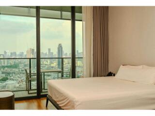 Bedroom with city view and balcony