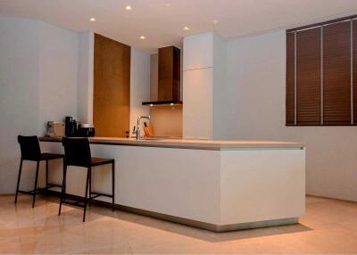 Modern kitchen with breakfast bar and appliances