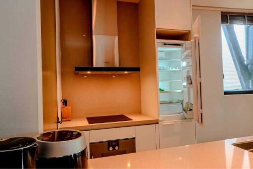 Modern kitchen with open refrigerator and appliances