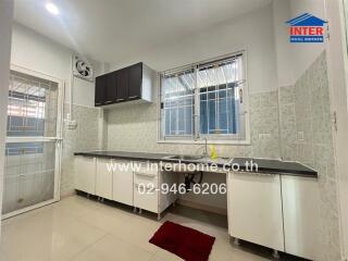 Modern kitchen with white cabinetry