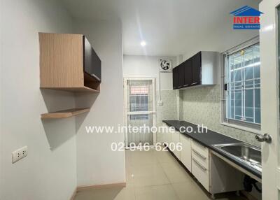 Modern kitchen with cabinets, sink, and stove