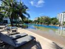 Beautiful outdoor swimming pool area with lounge chairs