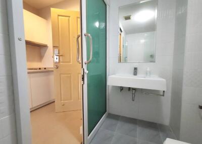 Modern bathroom with adjoining kitchen