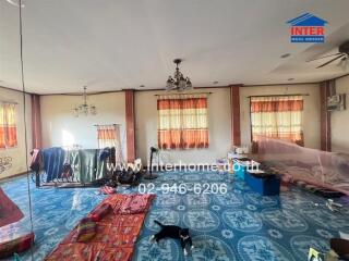 Spacious living room with large windows and natural light