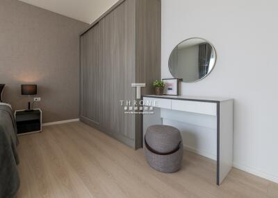 Modern bedroom with built-in wardrobe, dressing table, and modern decor