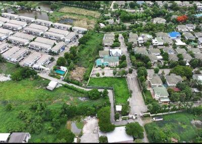 Aerial view of residential area showcasing various buildings and greenery