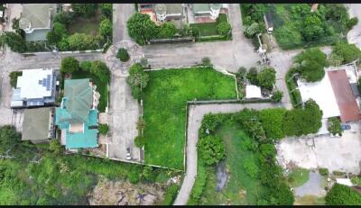 Aerial view of a residential neighborhood with houses and greenery