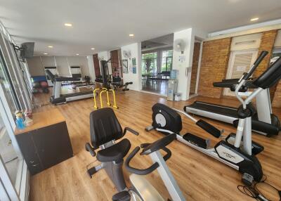 A well-equipped gym with various fitness machines.